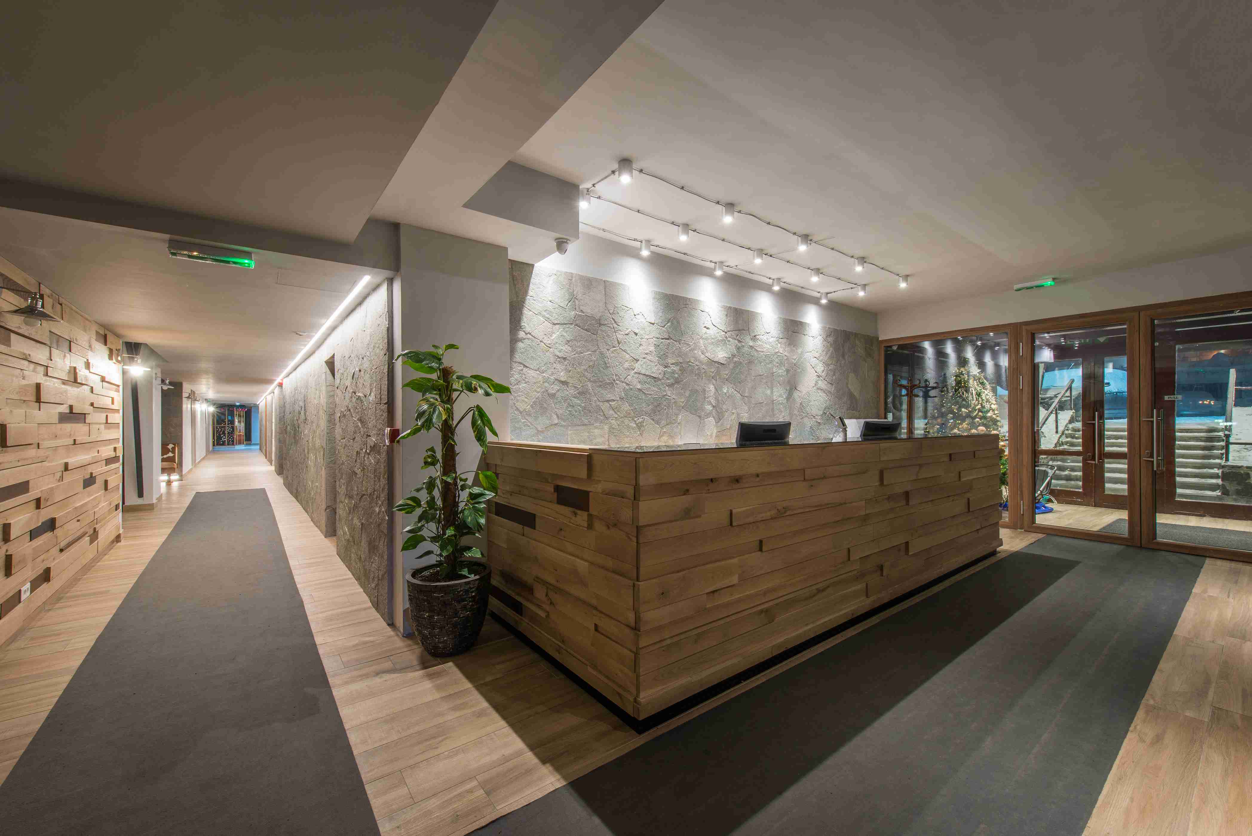 Boutique hotel reception desk in timber and stone