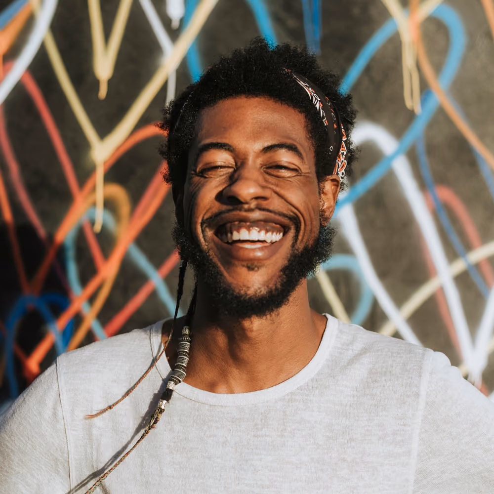 Smiling young man with short brown hair, warm and approachable portrait