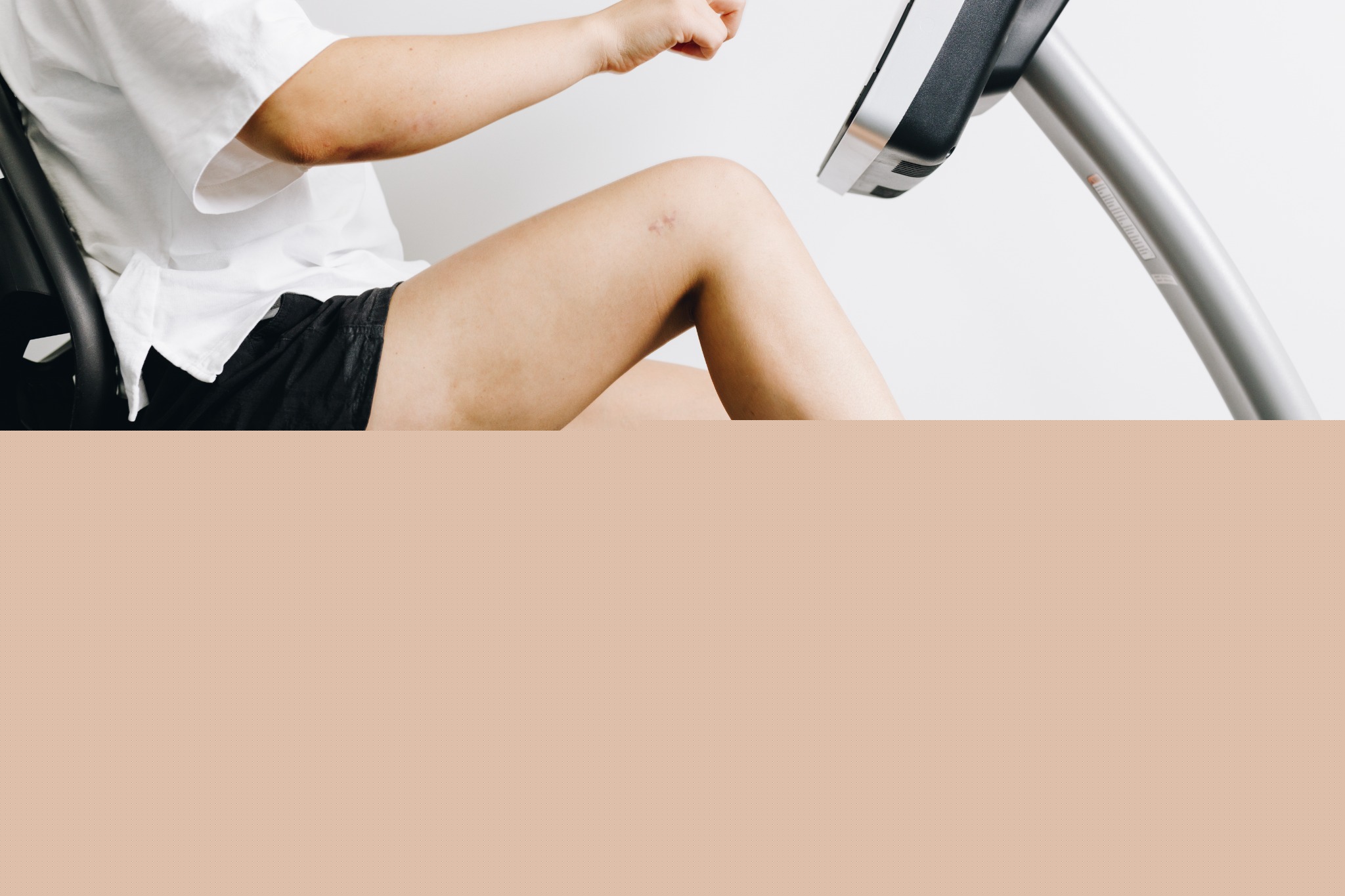 Person exercising on a stationary bike during knee rehabilitation