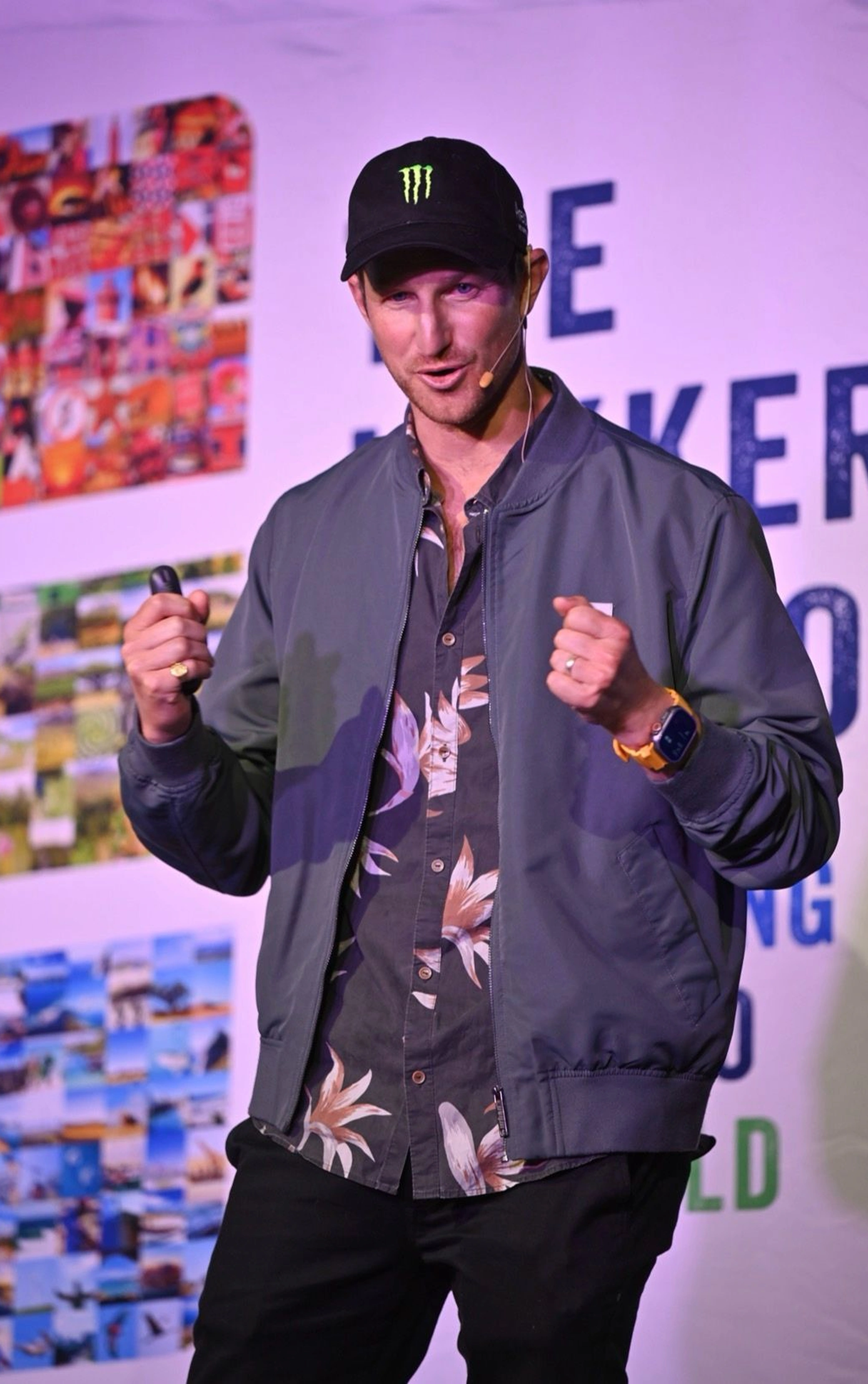Matt Bromley speaking on stage at a keynote event