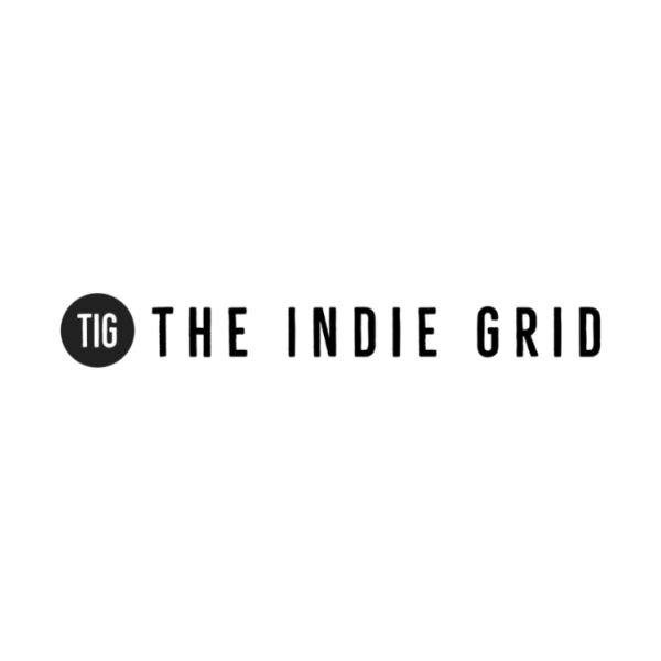 The Indie Grid logo with the acronym TIG inside a solid black circle followed by the text THE INDIE GRID in uppercase letters.