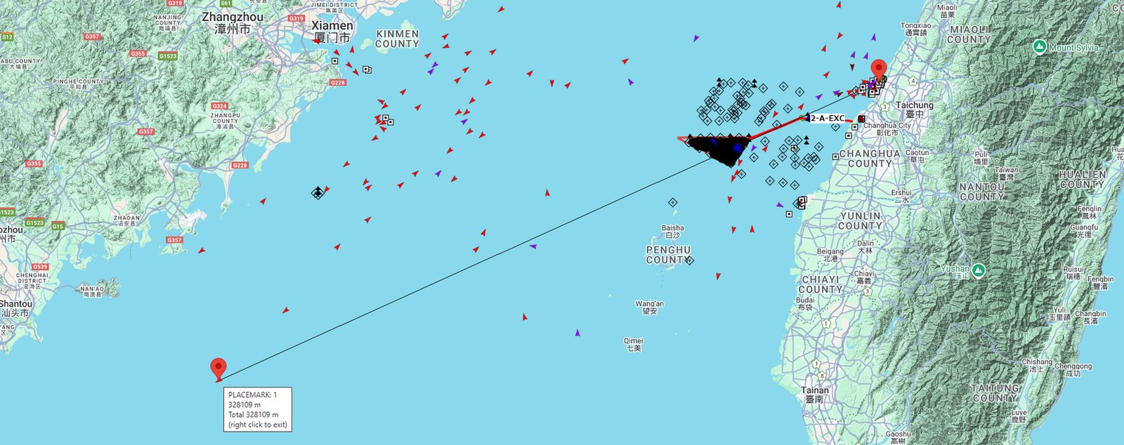 Map showing maritime locations and routes in the Taiwan Strait area between the coast of China near Xiamen and the western coast of Taiwan near Changhua County, with numerous small red and purple triangular markers indicating vessel positions and two red placemark pins connected by a straight line across the water.