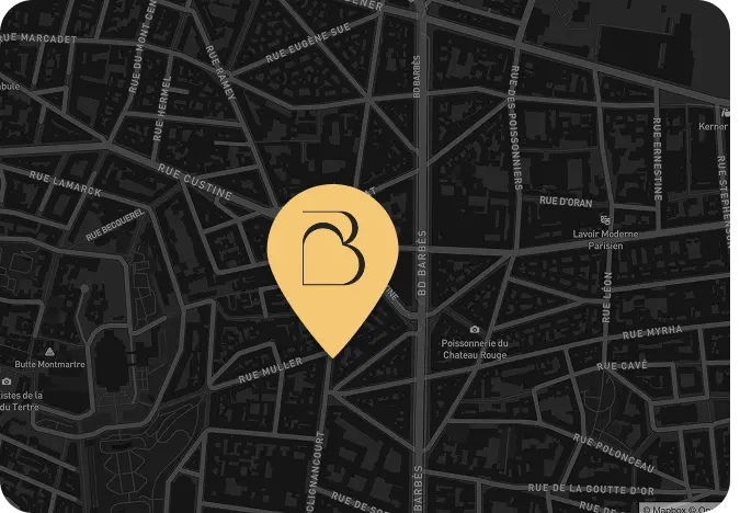 Carte sombre d'un quartier urbain avec une grande épingle jaune marquant un emplacement central près de la rue Muller et de la rue Custine, entourée de plusieurs rues nommées et points d'intérêt comme Poissonnerie du Chateau Rouge et Lavoir Moderne Parisien.