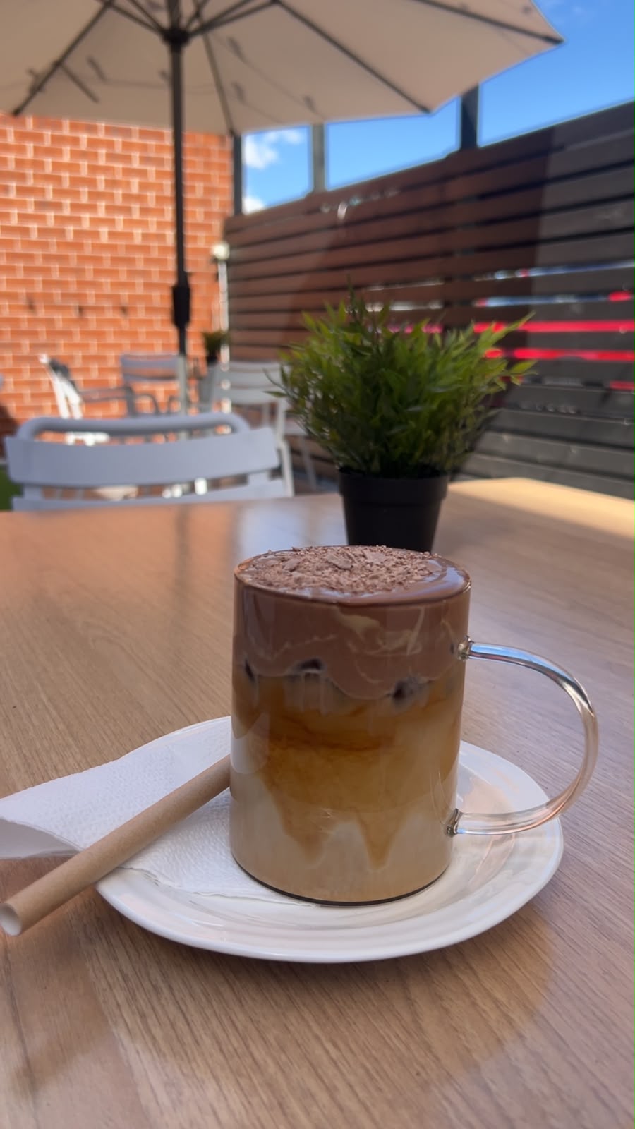 Illustrative image of an iced latte topped with cold foam