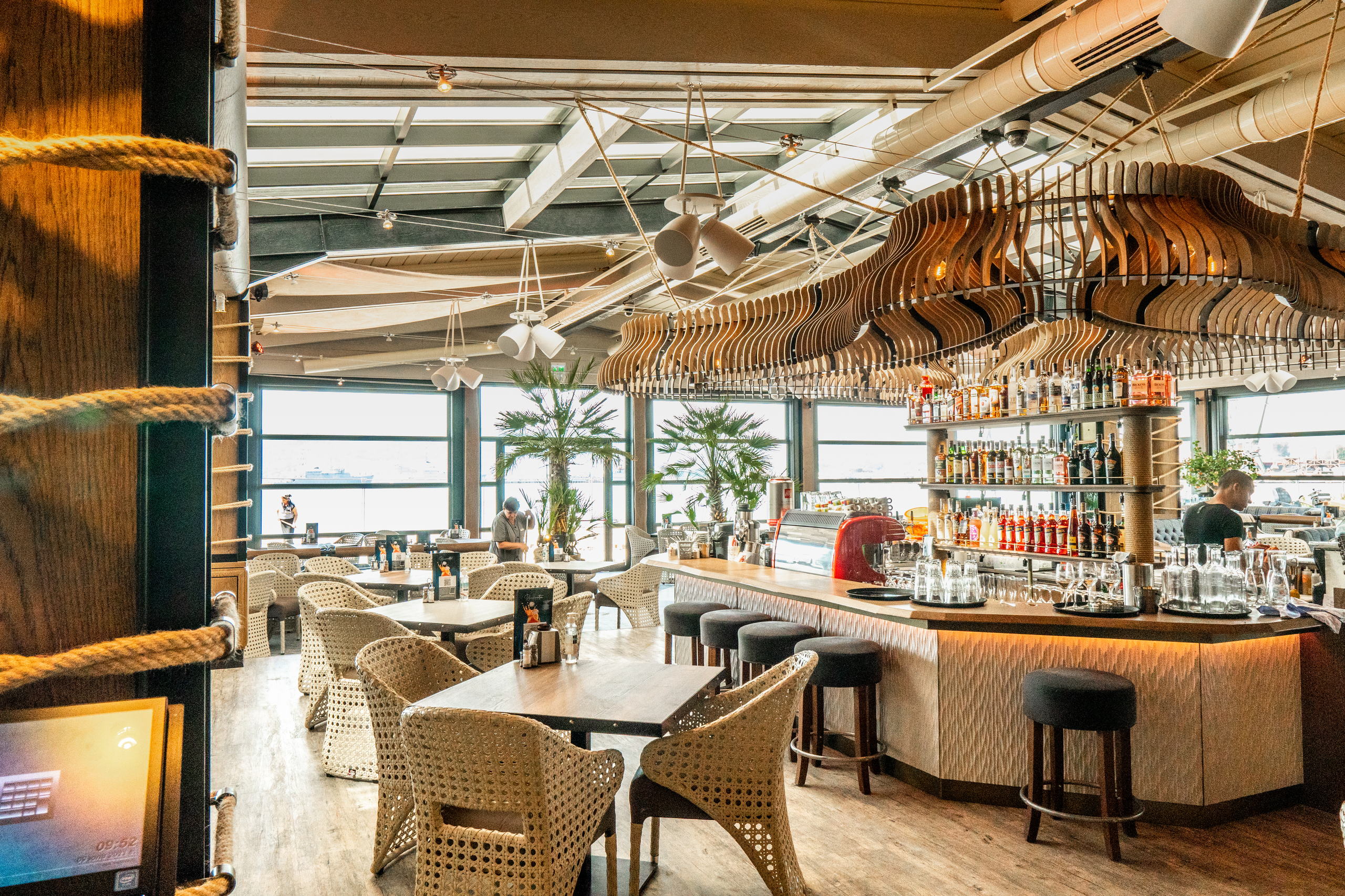 Restorant Burrata Harbour — the bar beneath the sculptural timber ceiling