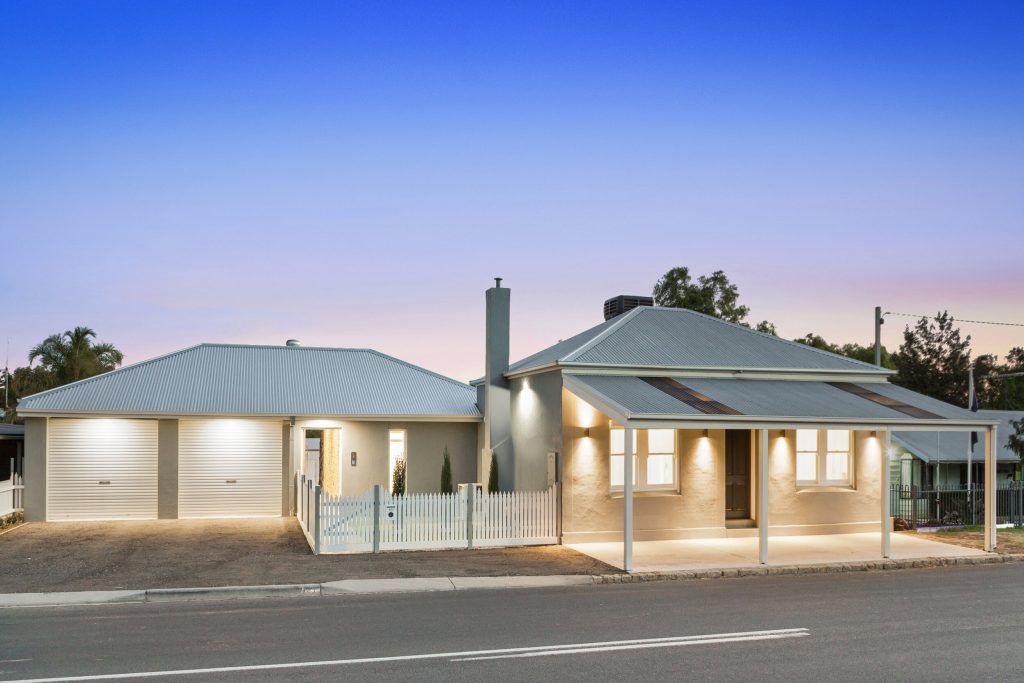 Renovated home facade with landscaping