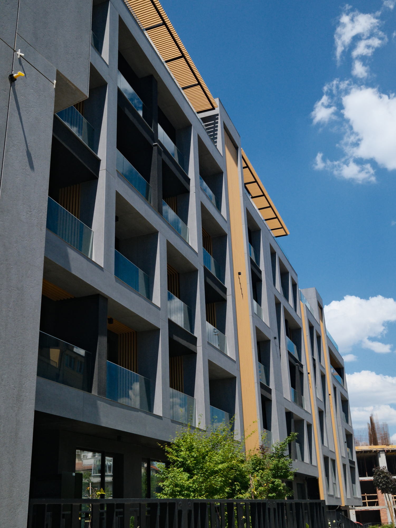 Borisa Apartments — balcony stack in raking light