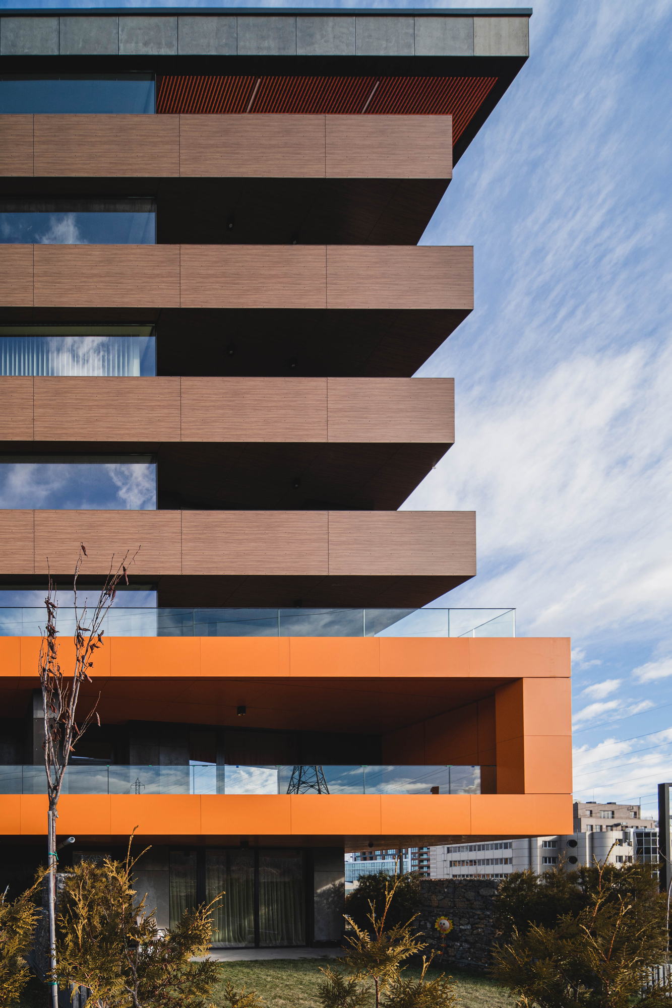 RUhouse — timber balconies over the entrance