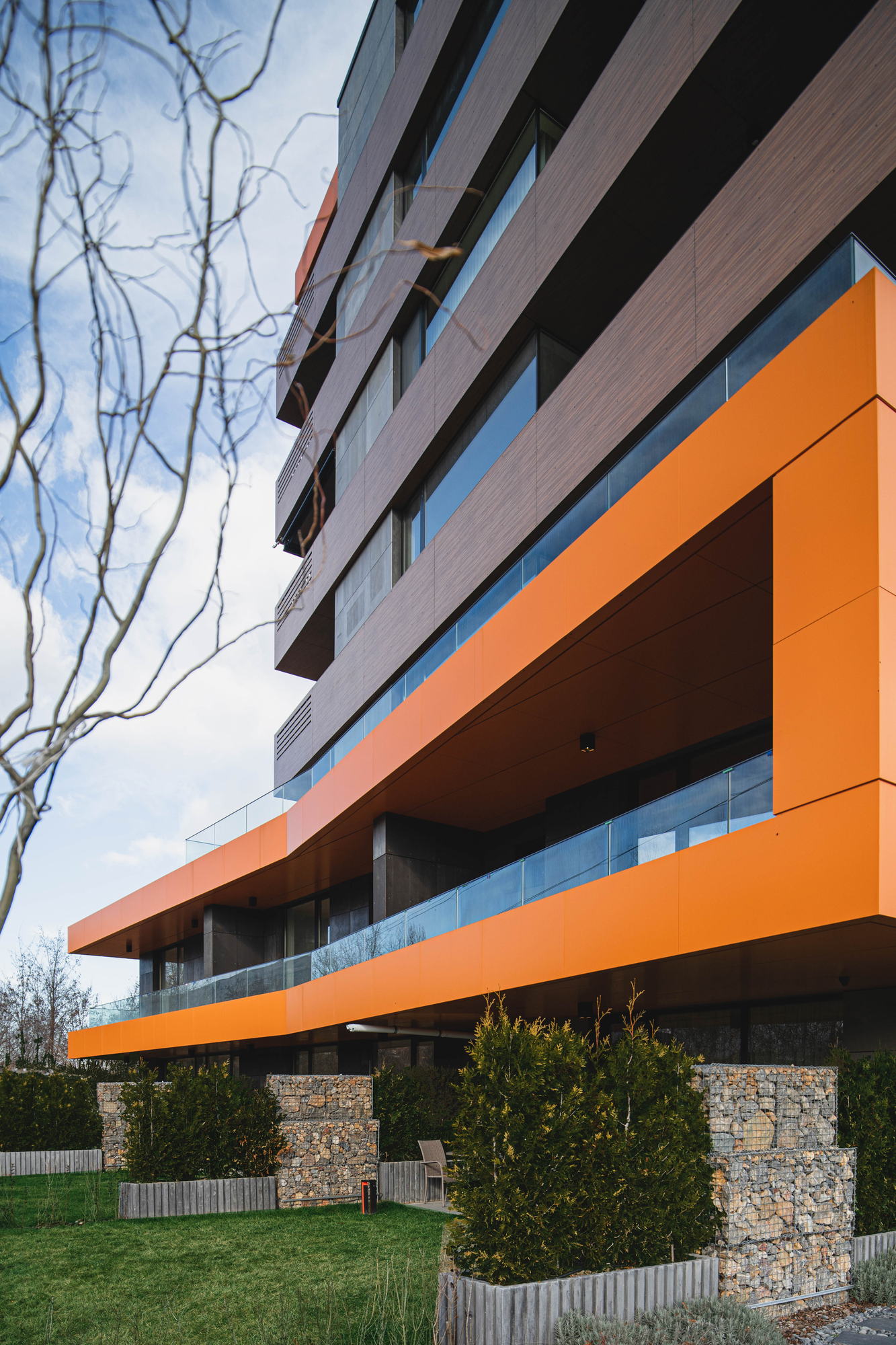RUhouse — the building above the planted retaining wall