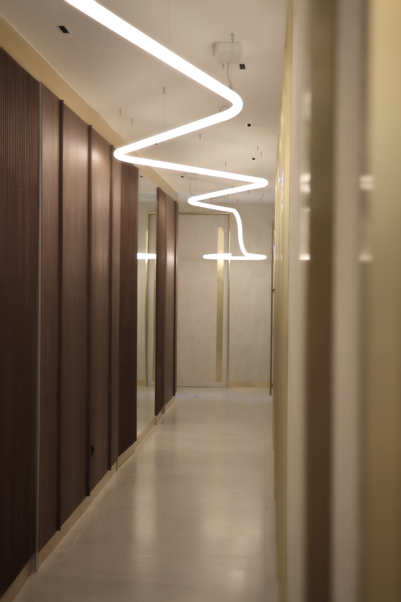VDERM — corridor between the walnut doors