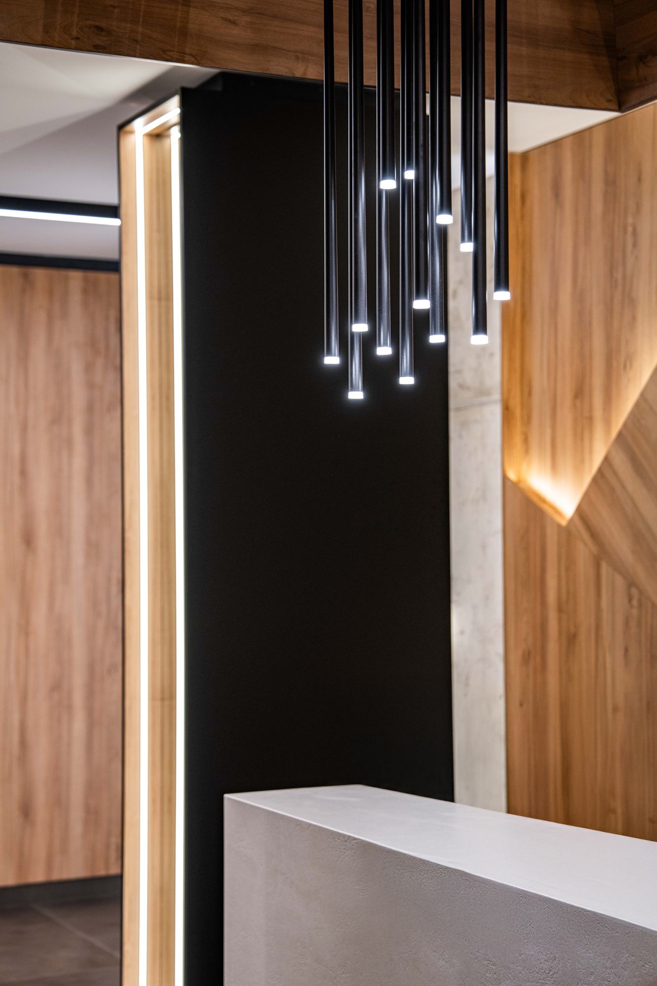 The Royal Residence — pendant cluster above the reception counter