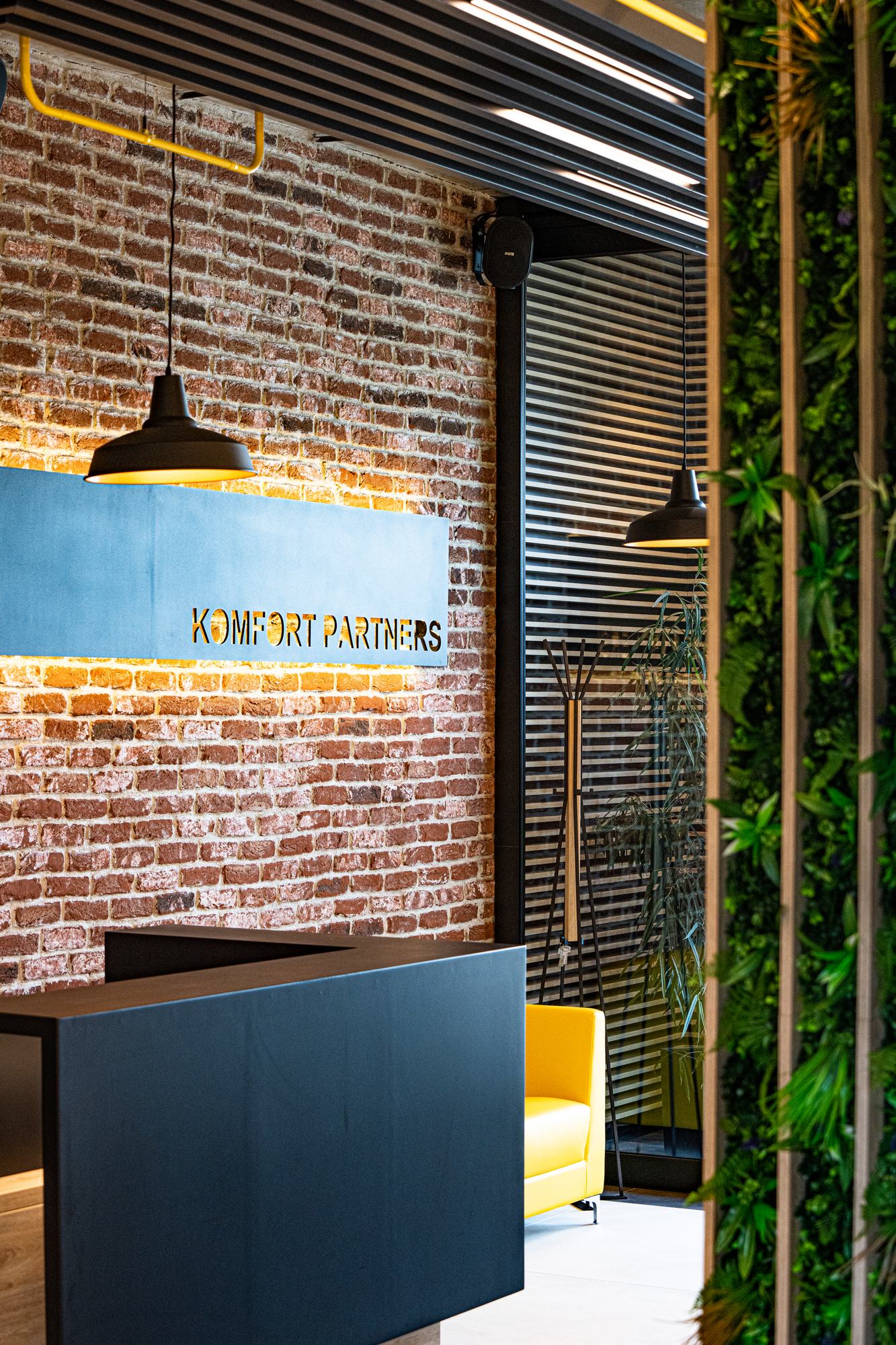 Comfort Partners Headquarters — the company name on the brick wall above the reception counter
