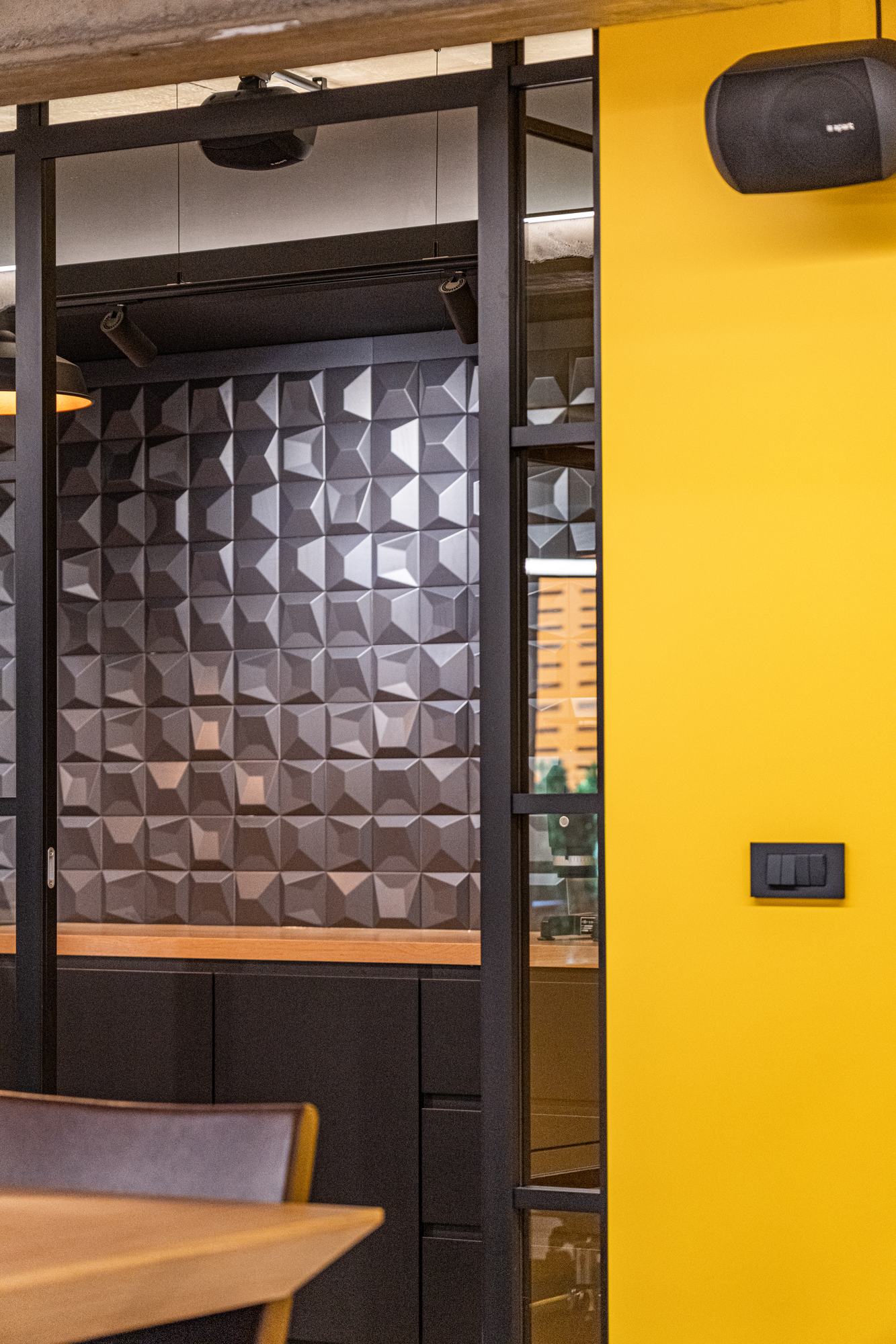 Comfort Partners Headquarters — moulded dark panelling beside the yellow door