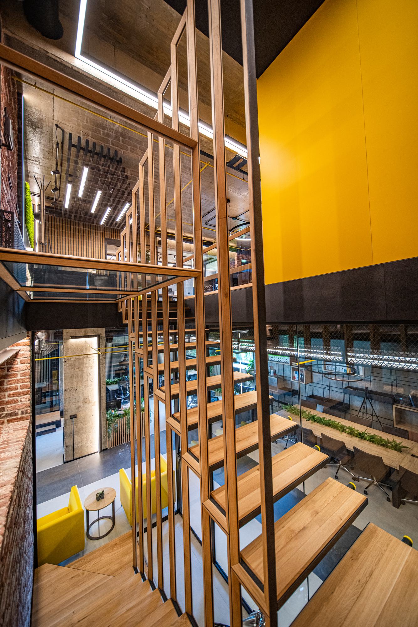 Comfort Partners Headquarters — the stair and metal screen seen from the upper level