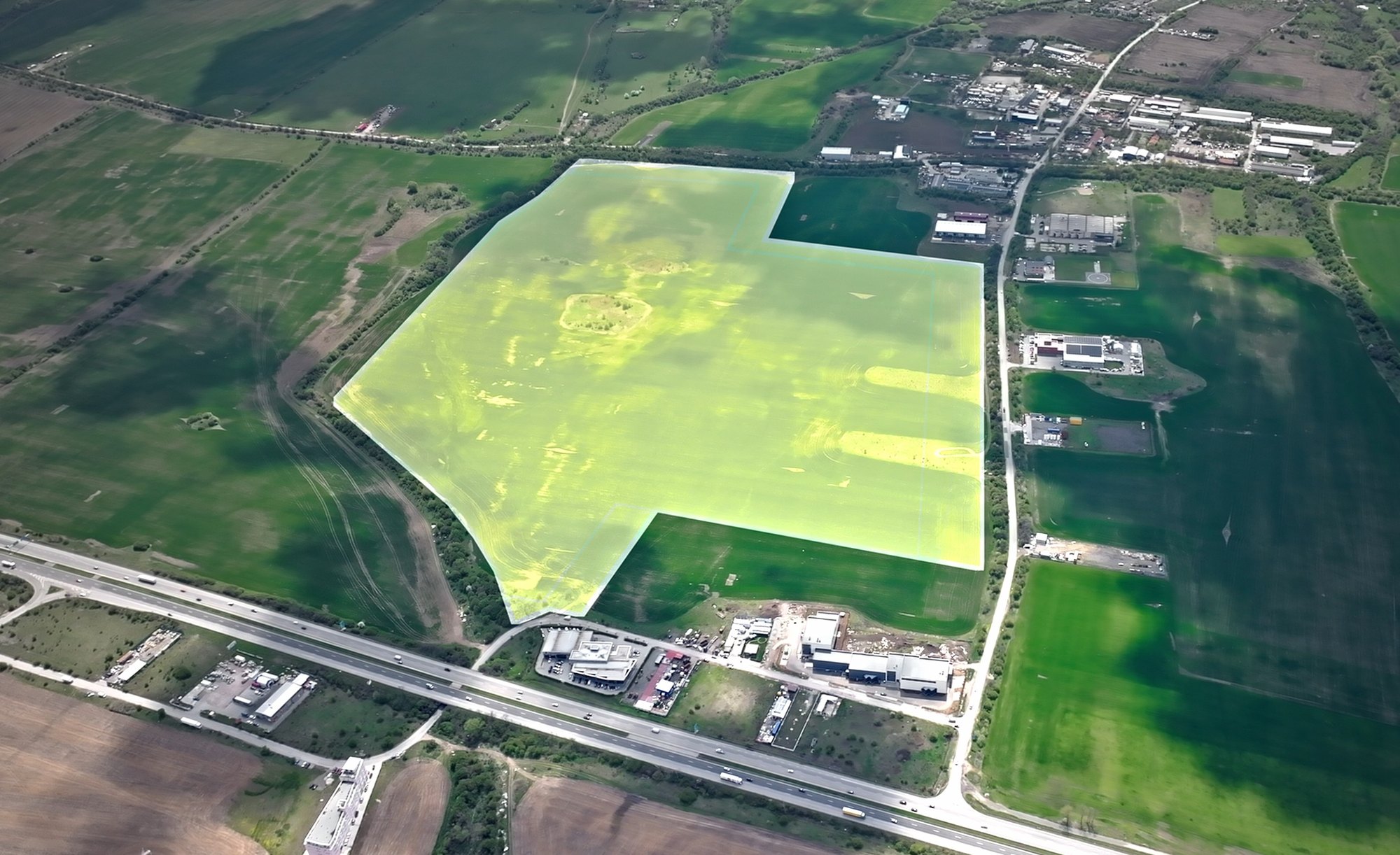 Dolni Lozen — the site outlined against the surrounding fields, with the road along its southern edge