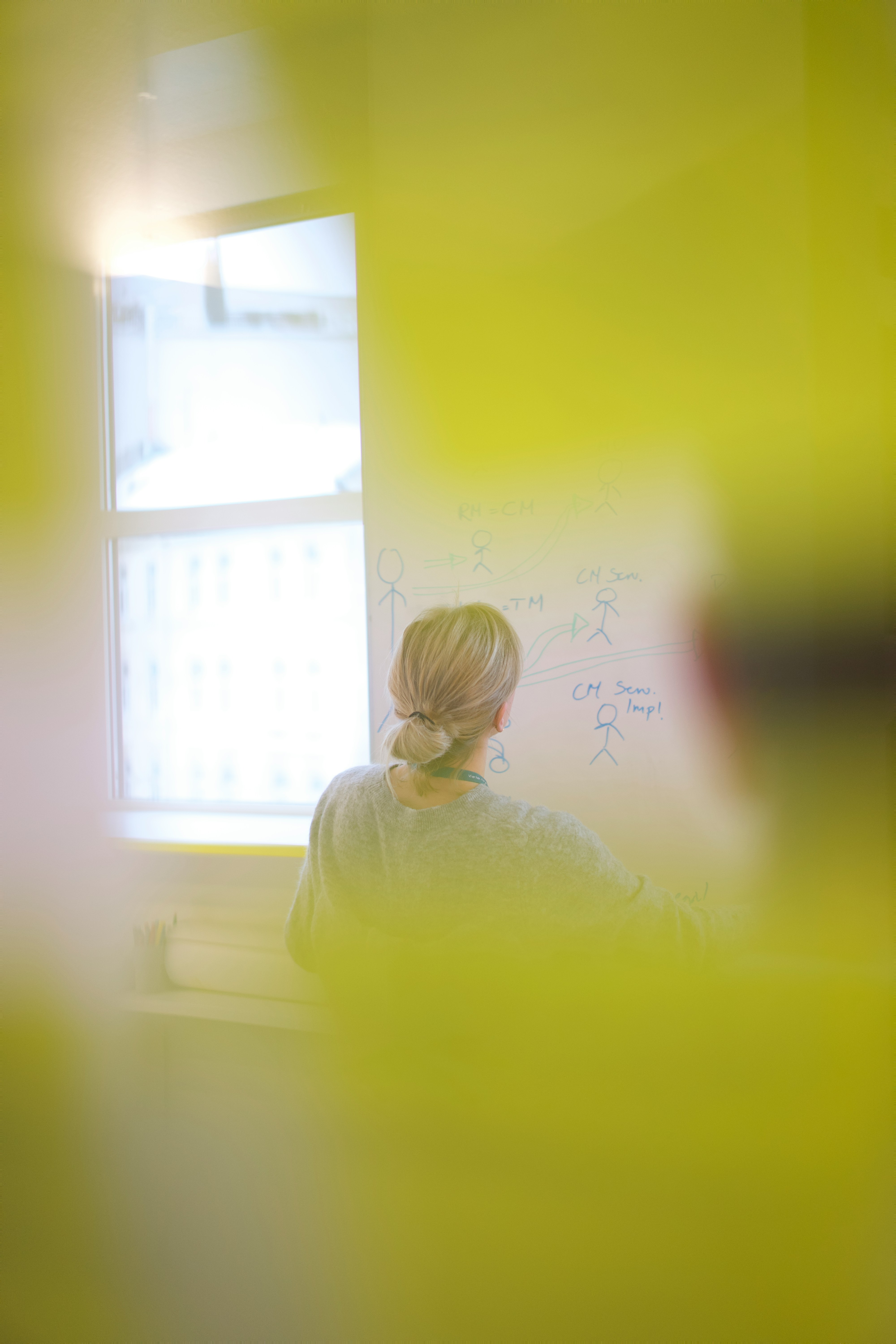 Woman in a meeting room.