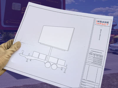 Hand holding blueprint design of a billboard trailer with a blank screen and company logo Insane Infact.