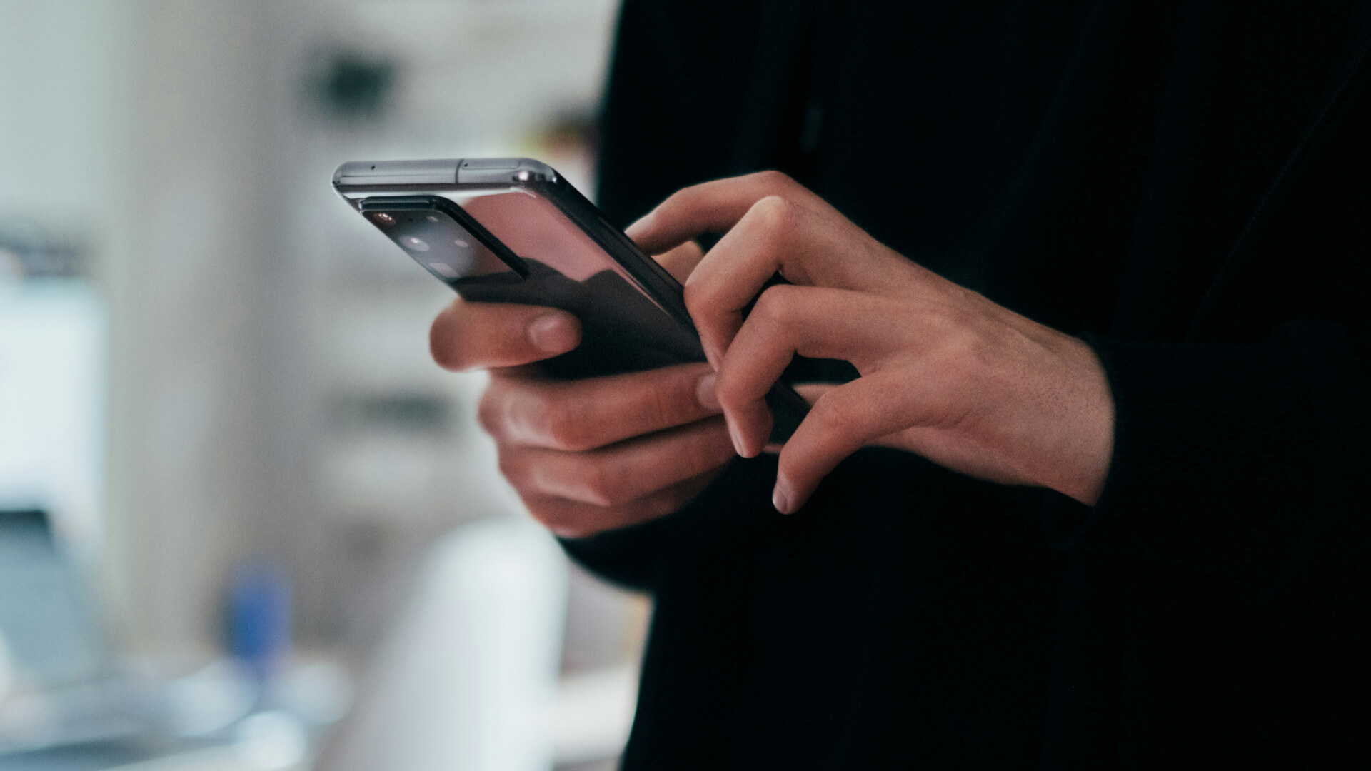 Patient using a smartphone to stay connected during a clinical trial