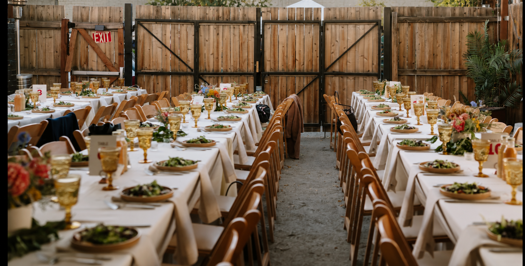 Wedding dinner tables set for guests on the Banshee House patio
