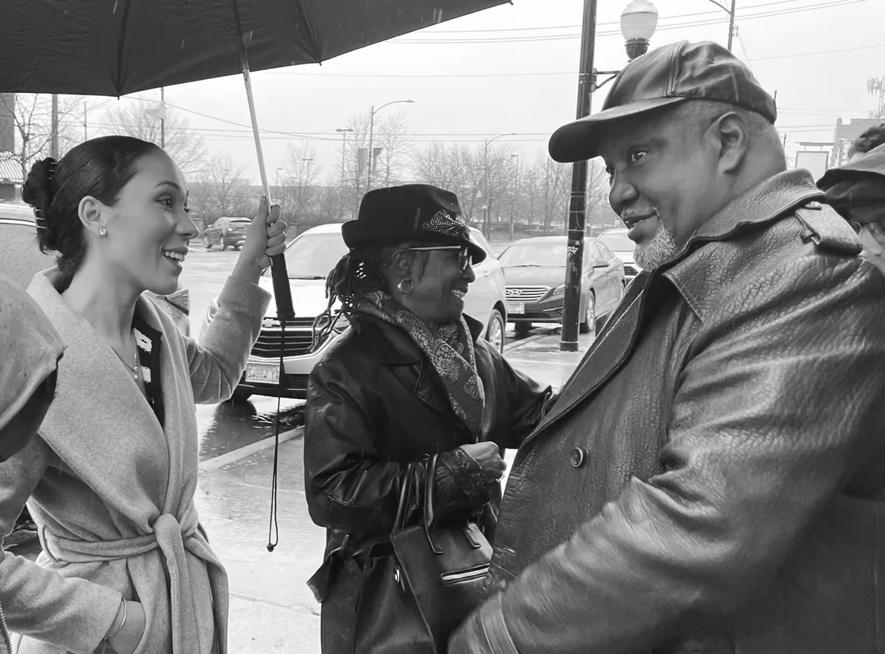 Anabel Mendoza speaking with Reverend Hood.
