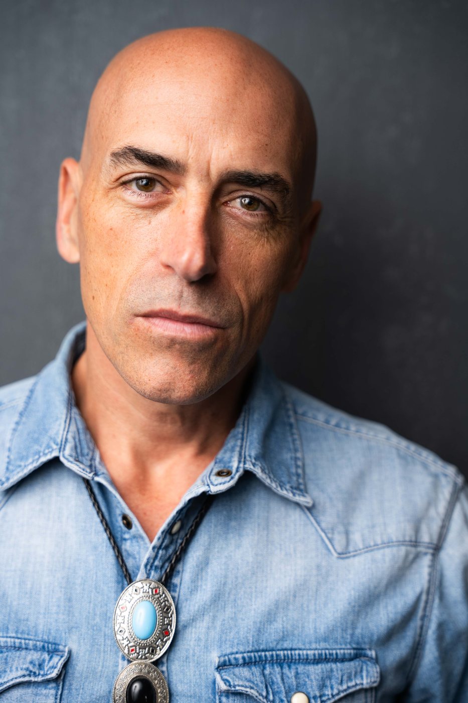 Nick Jude portrait in denim with bolo tie
