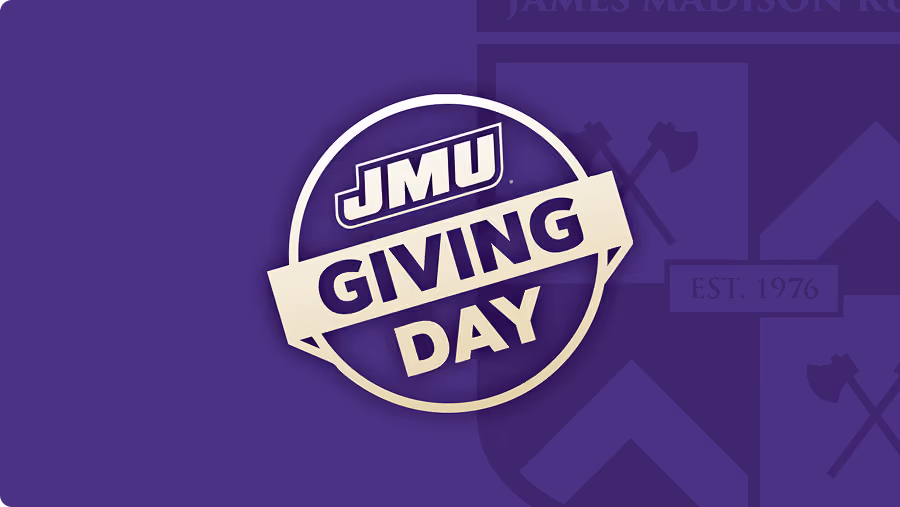 JMU Giving Day logo in white and purple with a circular design on a purple background, featuring a faint emblem with crossed axes and the text EST. 1976.