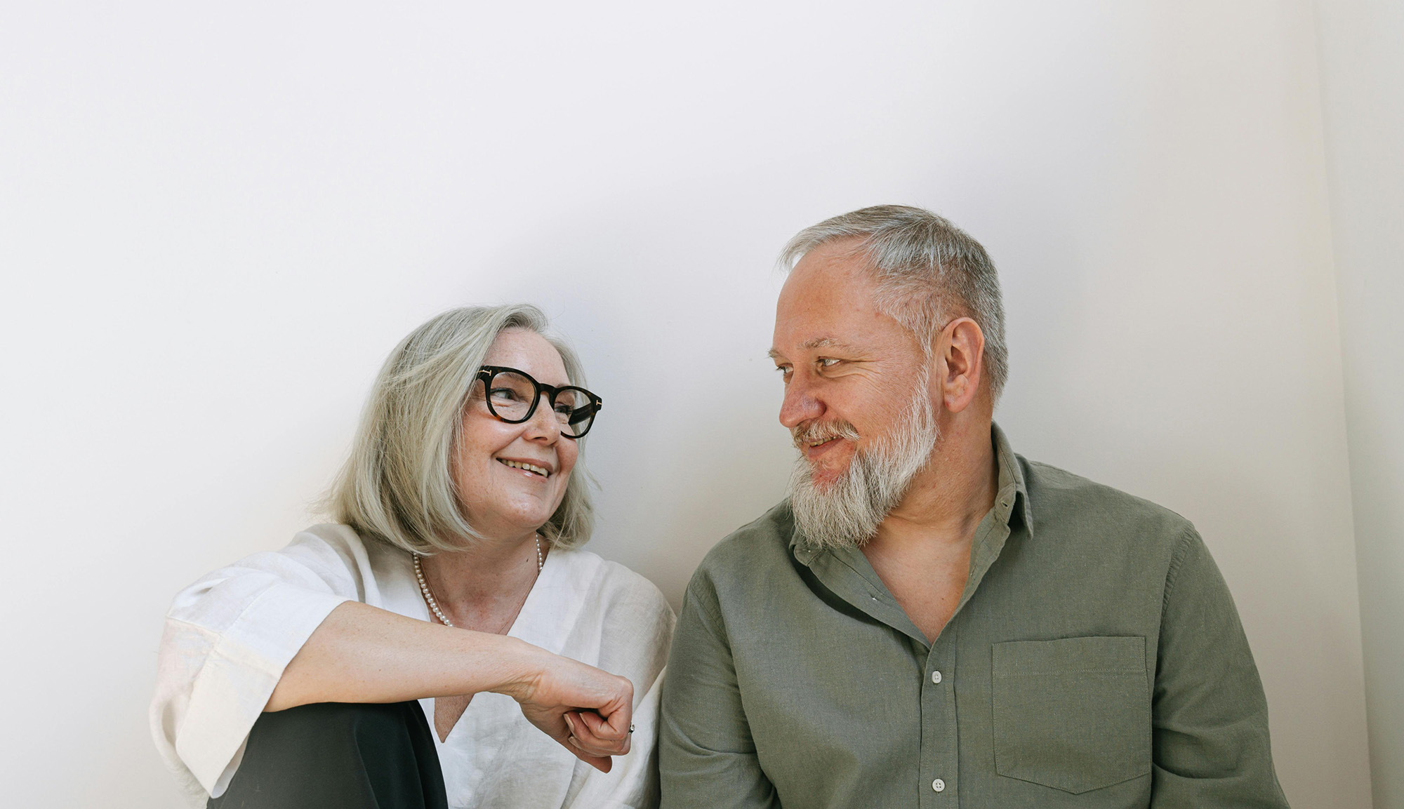 Smiling older couple looking at each other