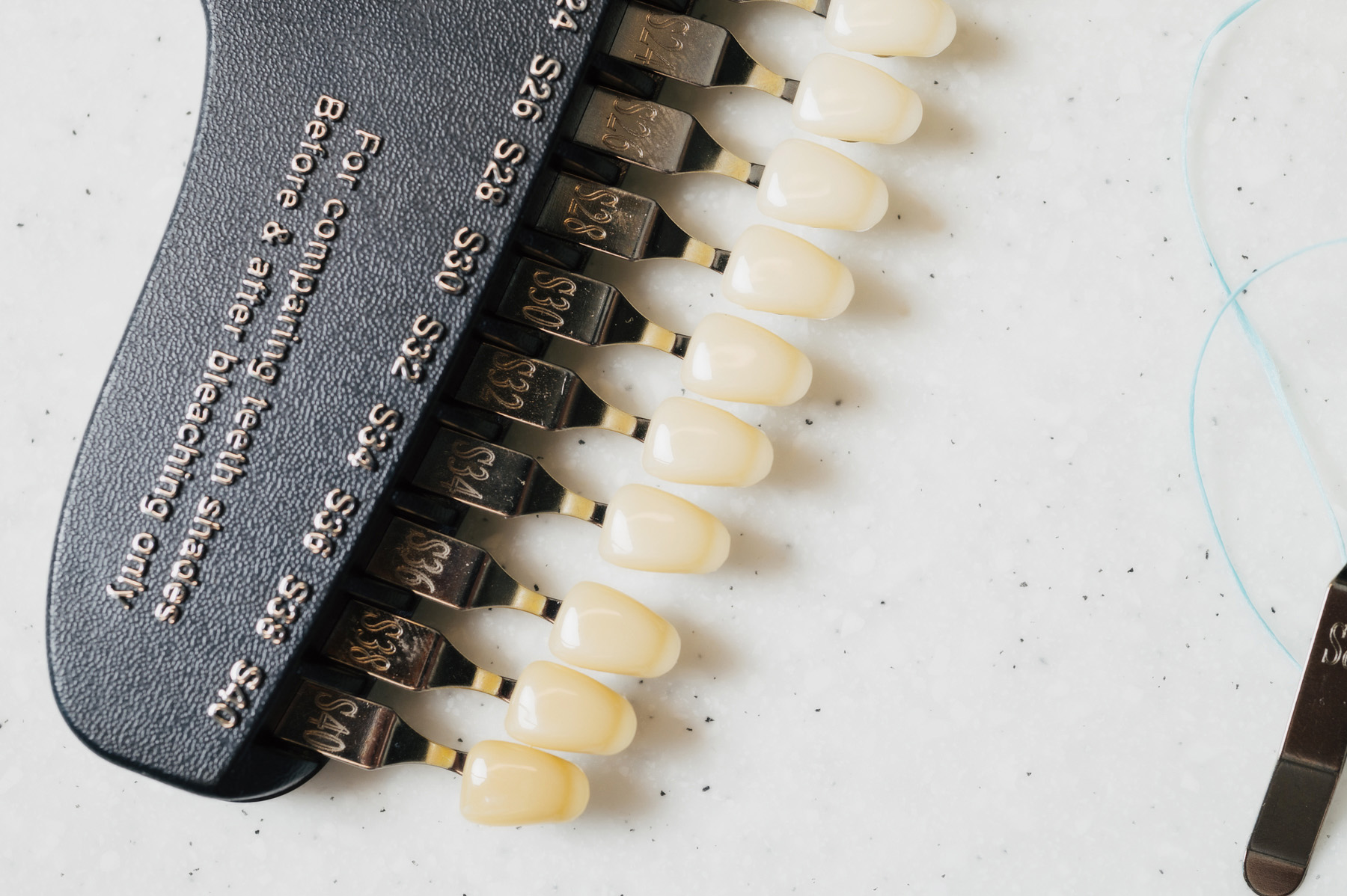 Close-up of a tooth shade guide used for comparing teeth whitening results