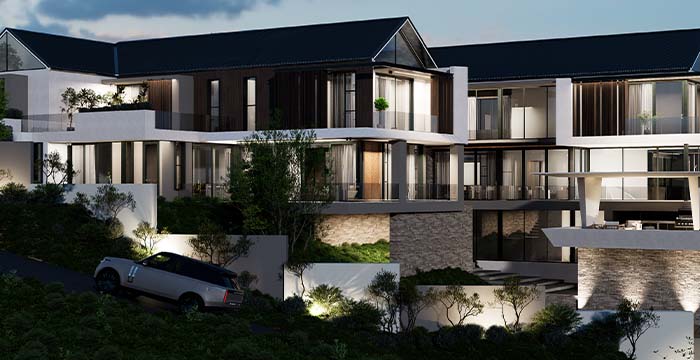 Luxury modern house at dusk with large glass windows, multiple balconies, stone and white exterior walls, surrounded by trees, with a parked SUV on a sloped driveway.