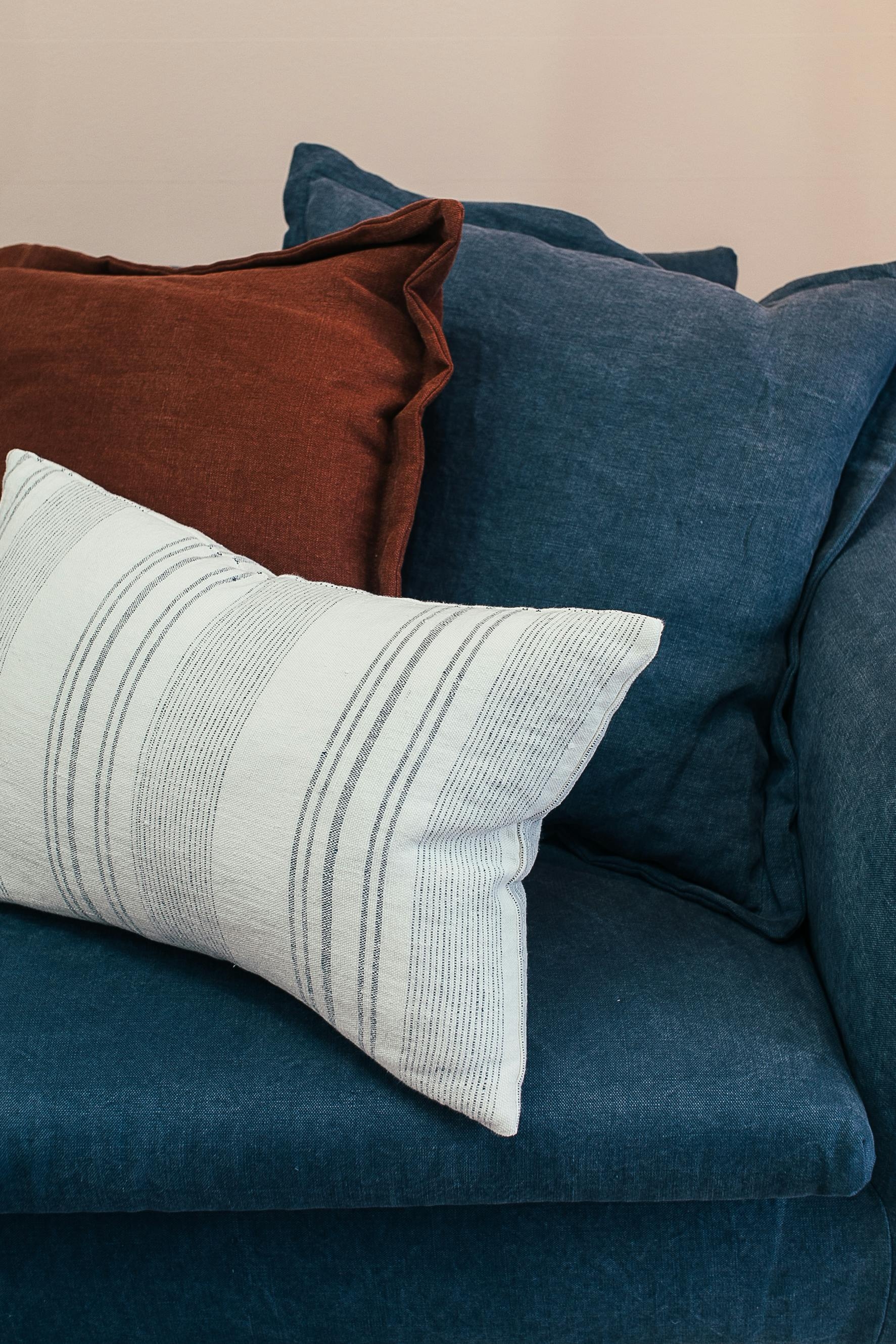 Blue couch with pillows stock image