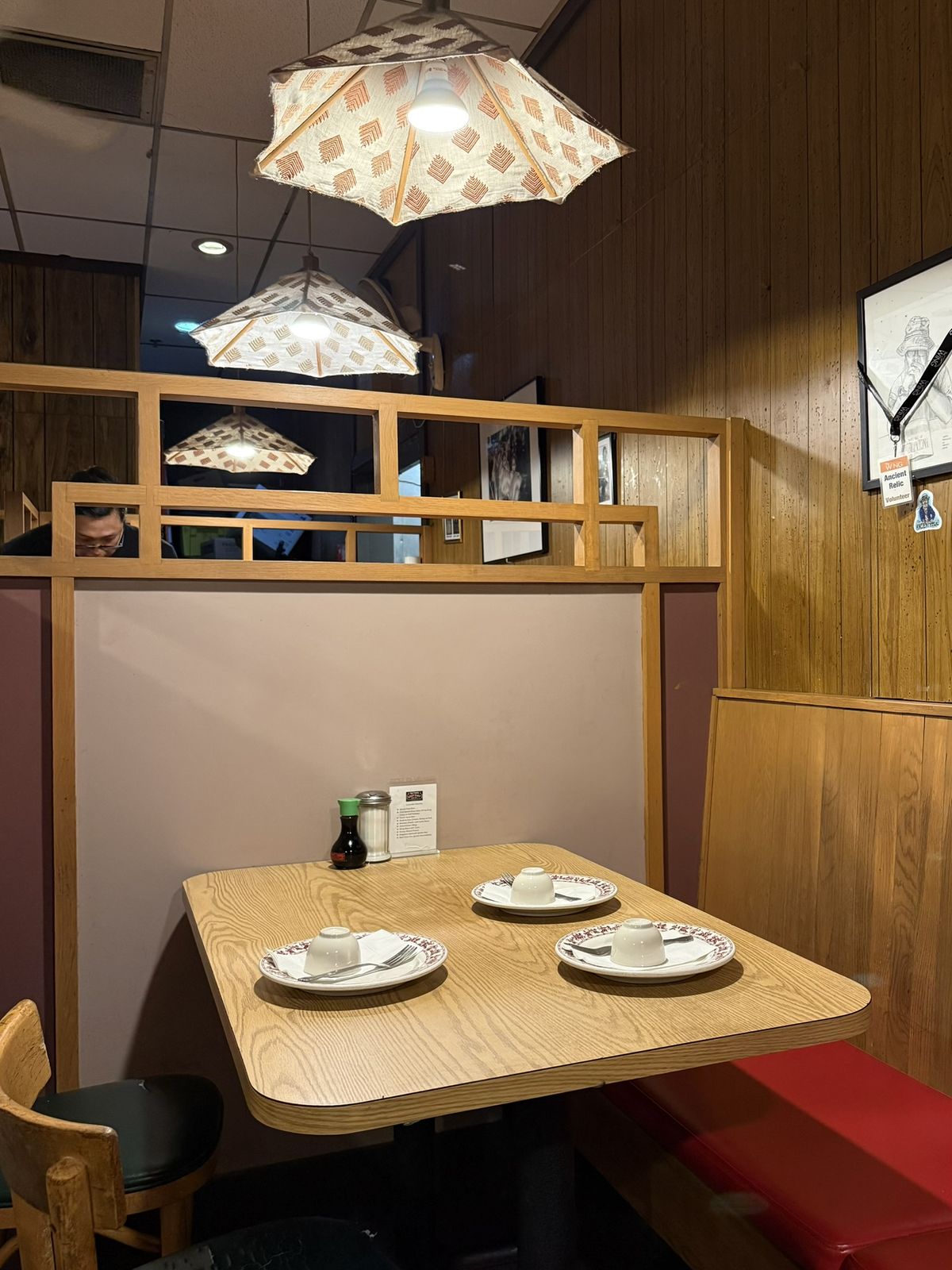 The booth table at Tai Tung, set for the meal with Western-sized plates and a fork