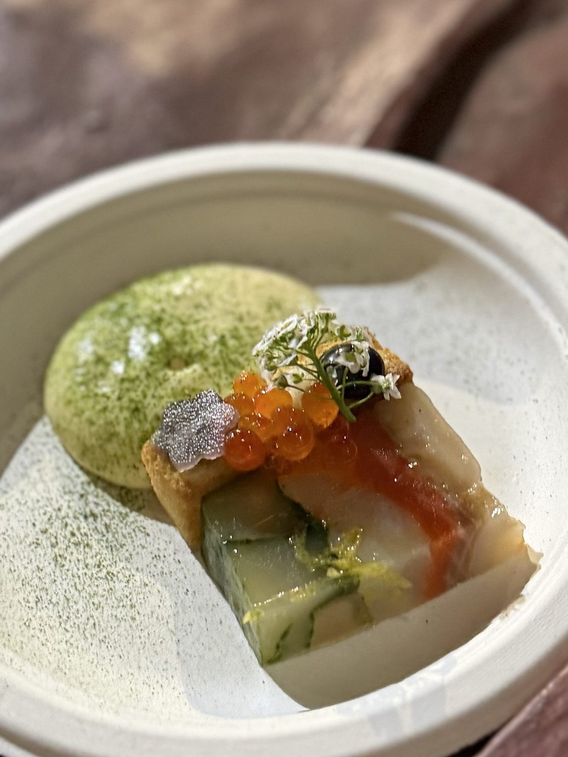 Close view of the seafood terrine, its layers of geoduck and smoked salmon edged with toasted brioche