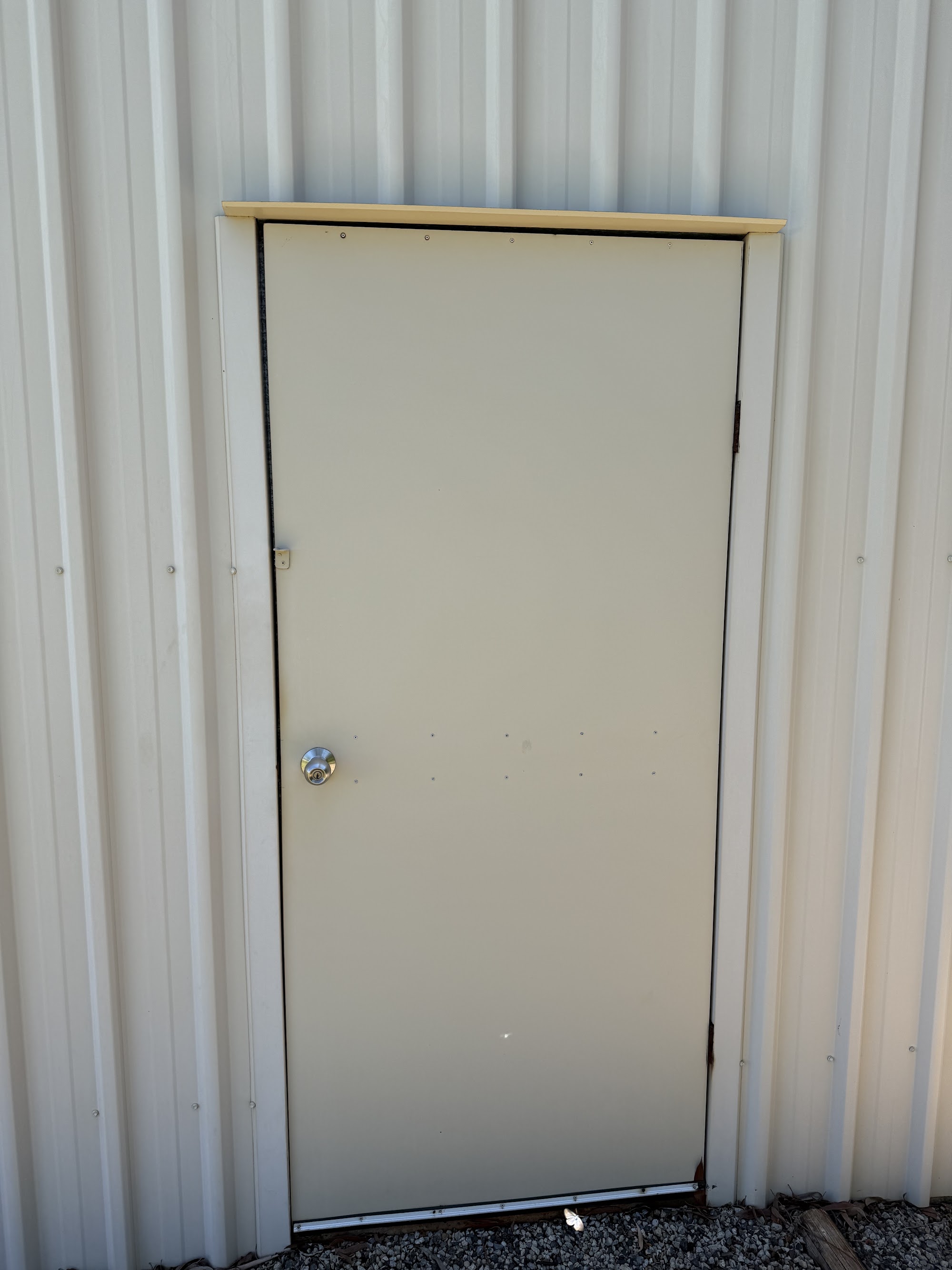 Shed personnel door and surrounding sheeting after cleaning