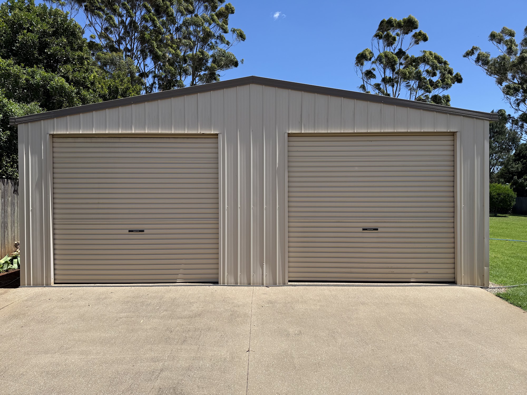 Double roller door shed and driveway apron after a TopWash clean