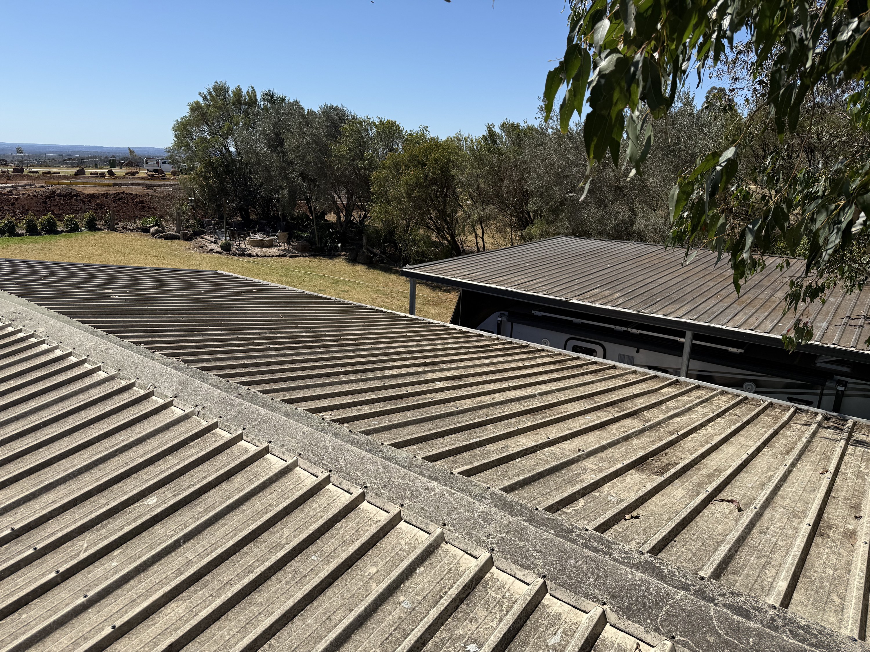 Weathered Colorbond roof on a Toowoomba rural property before soft washing