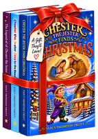 A holiday-themed boxed set of three children's books by Nancy Thompson-Truitt titled 'Chester the Jester Finds Christmas,' 'Chester the Jester Goes to the Beach,' and 'The Legend of Chester the Jester,' wrapped with a red ribbon and bow, featuring festive winter and Christmas illustrations including a nativity scene with Mary, Joseph, and baby Jesus on the front cover.