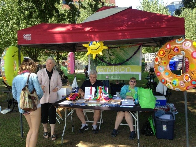 AMTA Oregon volunteers at a community outreach booth