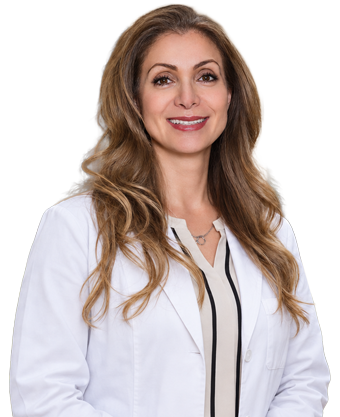 Dr. Leila Khamsei wearing her white dental coat