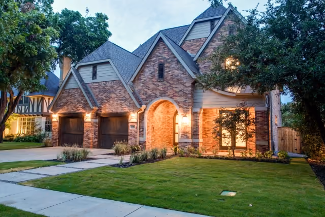 Brick exterior of a completed Cambridge home at dusk