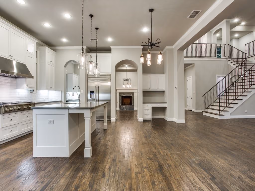 White kitchen cabinetry and island in a completed Cambridge home