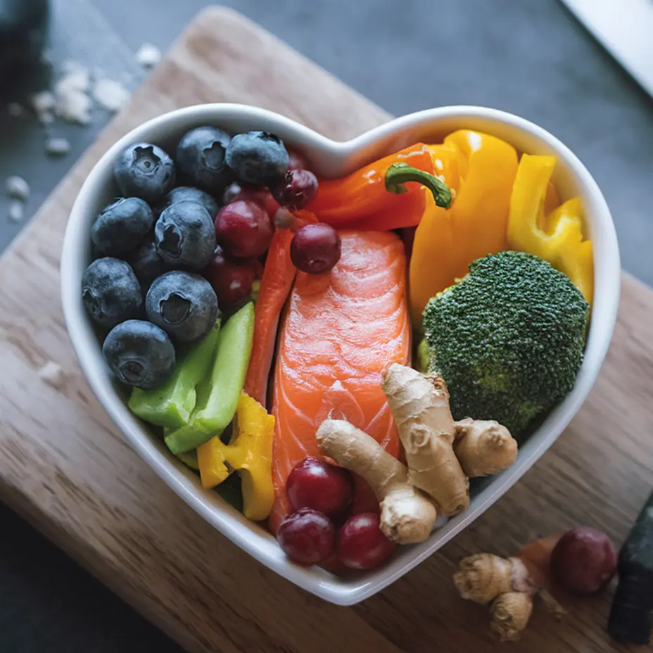 Aliments frais disposés à plat : bananes, avocat, saumon, œufs, légumineuses et oléagineux
