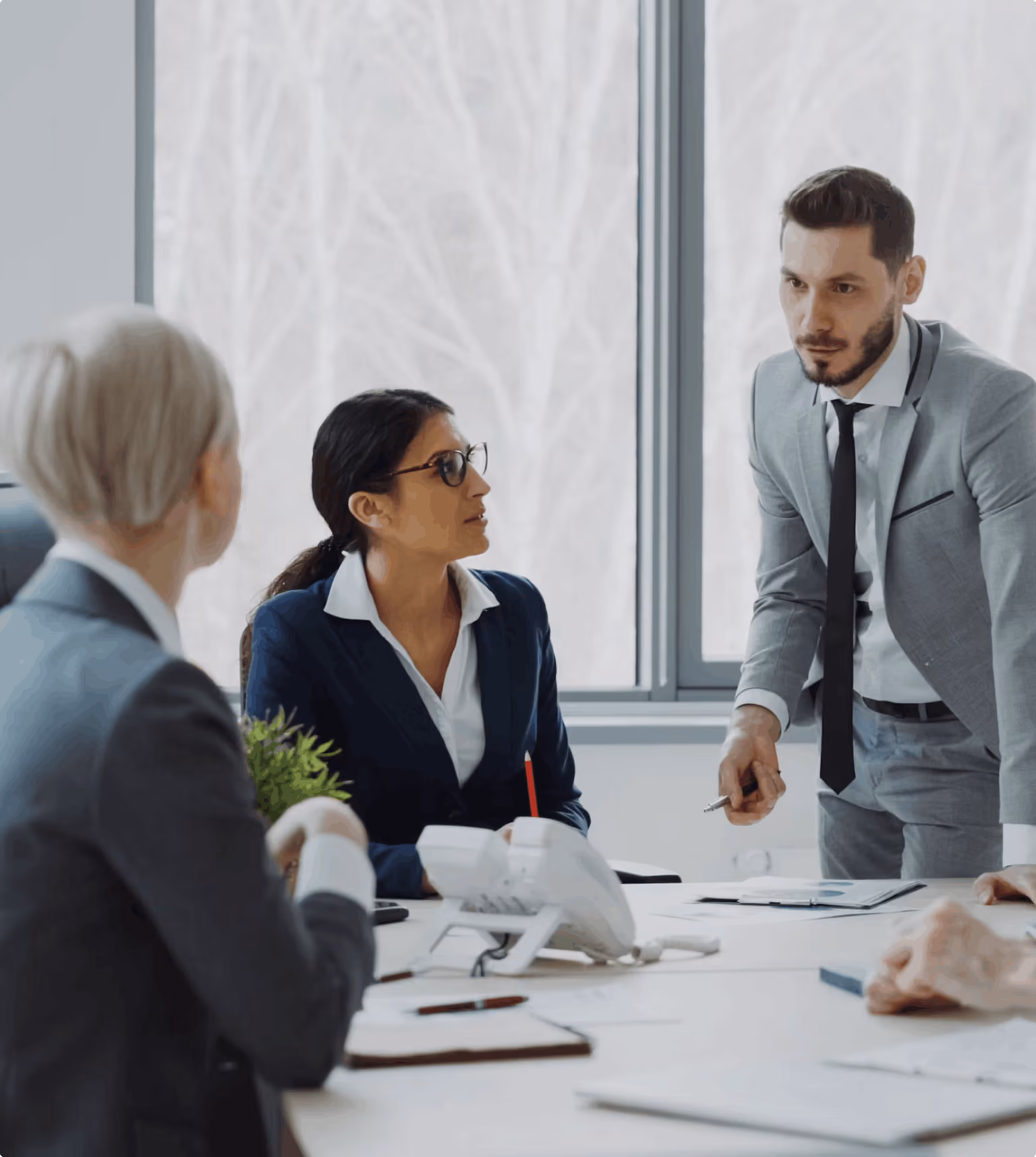 Senior business leaders discussing workforce strategy in a boardroom meeting