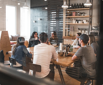 Team in a group discussion in a collaborative workspace