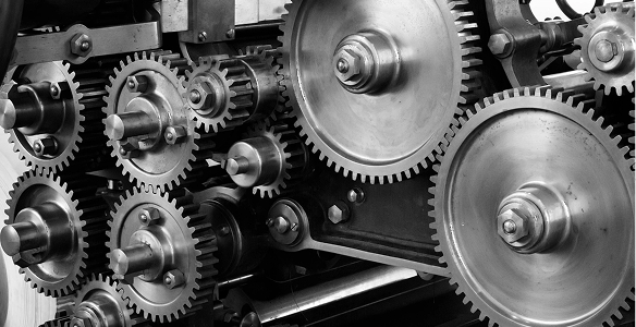 Interlocking industrial steel gears and cogs in a mechanical assembly