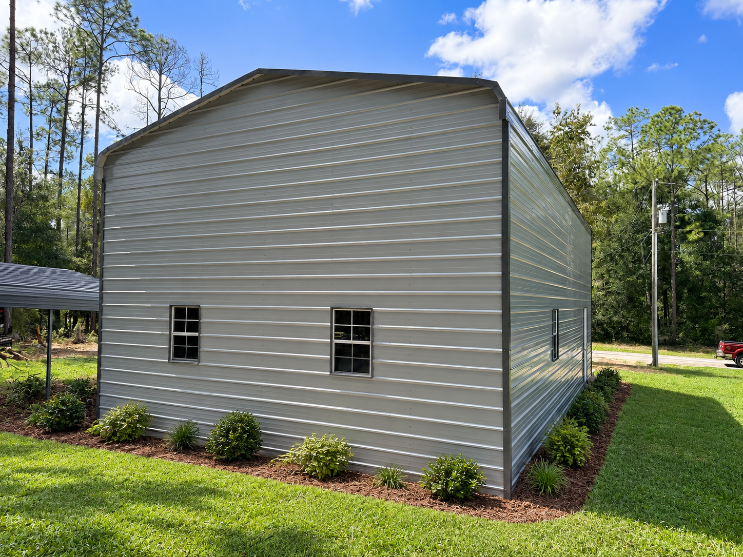Light metal building with visualized landscaping