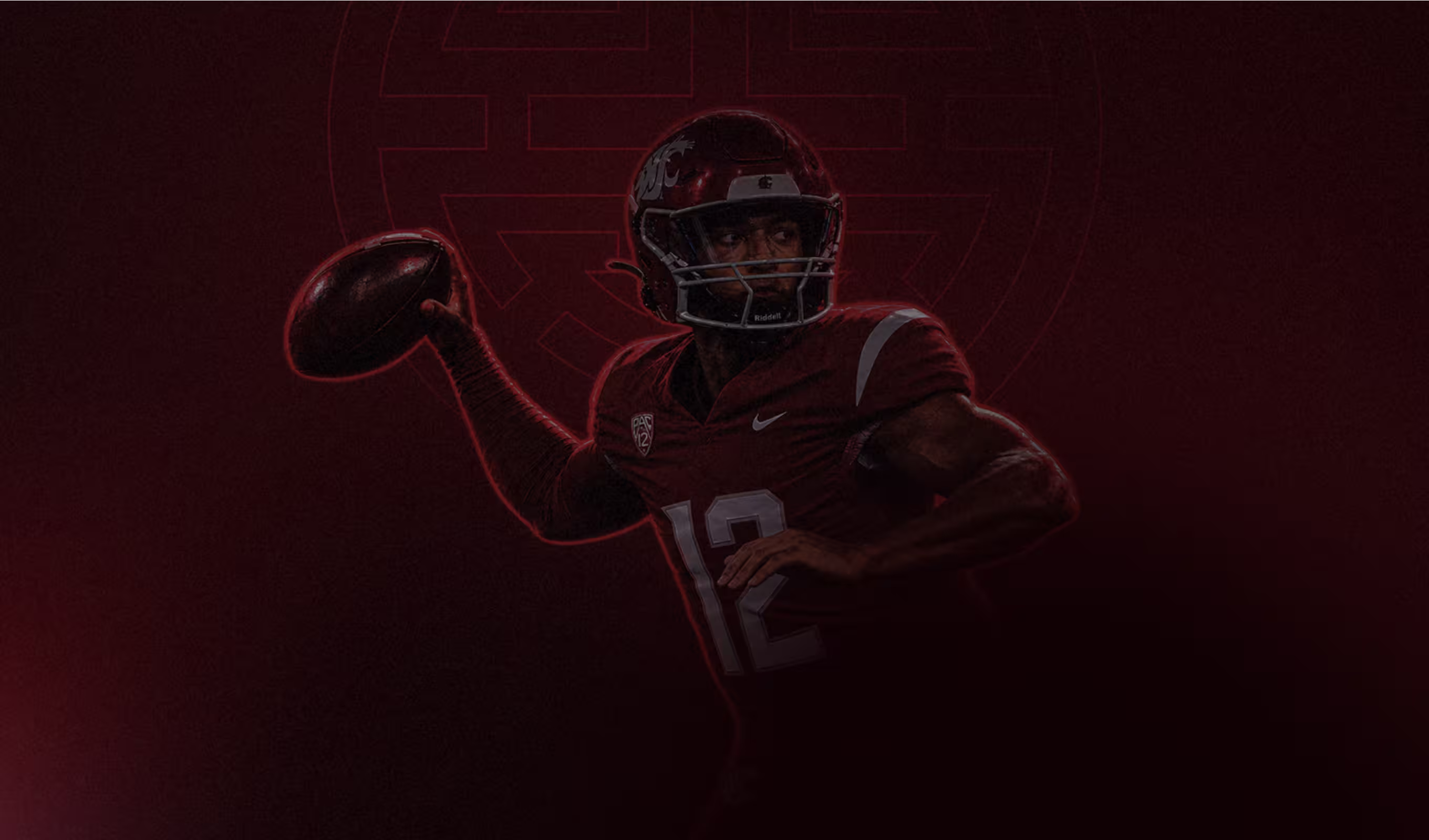 Football player wearing number 12 jersey in maroon preparing to throw a football.