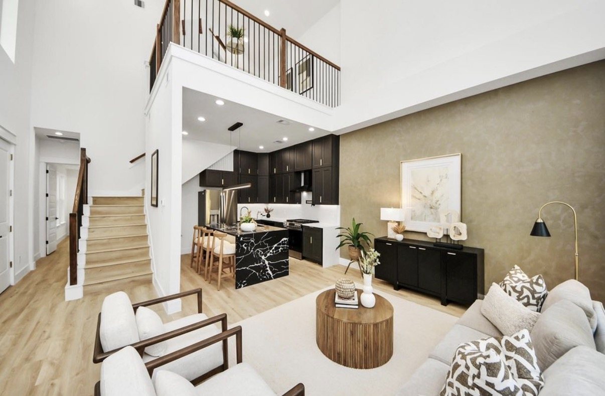 Open-plan kitchen and living space with a two-storey ceiling