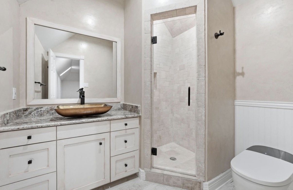 Tiled shower wall with blocking behind it for grab bars