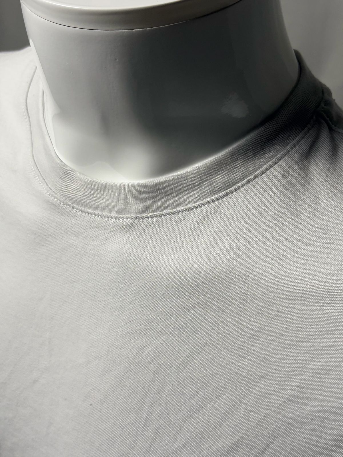 Close-up of the Banana Republic Luxury-Touch T-Shirt crew-neck collar on a mannequin