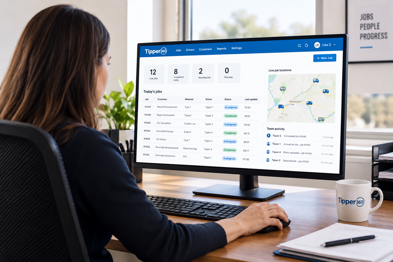 Office team viewing live digital delivery information